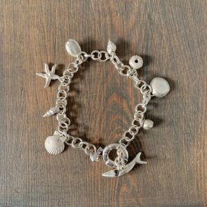 Fay Page - Solid silver shell charm bracelet with fish clasp