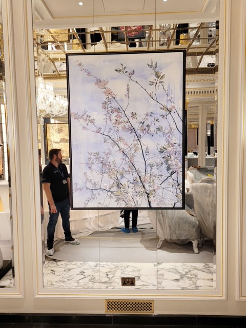 Melanie Goemans painting being hung in The Dorchester Artists' Bar